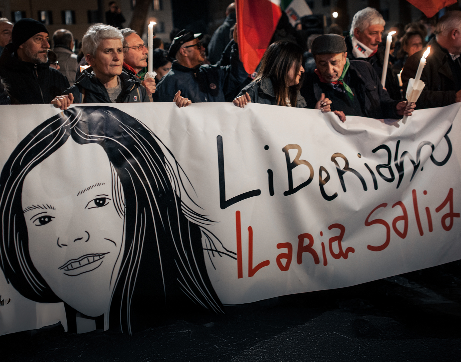 People participate in a torchlight procession organized by the Liberiamo Ilaria Salis committee. Photo: Andrea Ronchini/NurPhoto via Getty Images