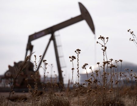 Oil pumpjack amid rising oil prices.