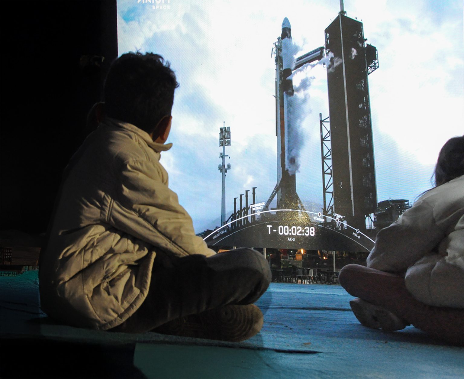 Children watch the launch of the Axiom 3 mission to the International Space Station on large screens in Mersin, Turkey. Photo: Murat Pancar/Anadolu via Getty Images  