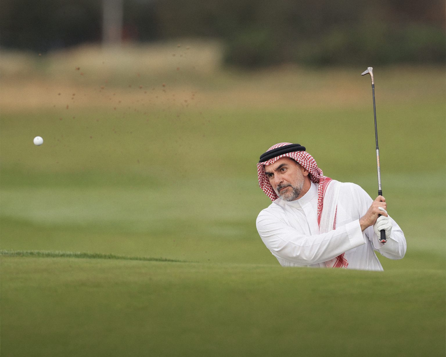 Illustration of Yasir Al-Rumayyan playing golf in traditional Arabic dress. Image: Richard Heathcote/Getty Images/ChatGPT