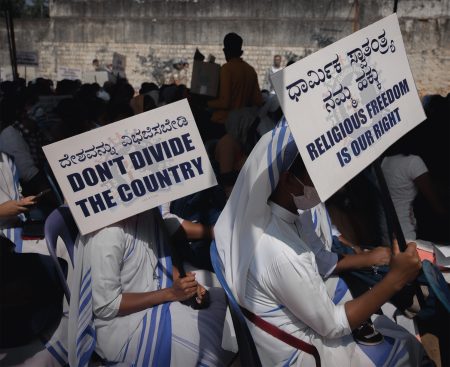 Christian nuns protest in India, holding signs calling for religious freedom and warning against division, amid growing concern over state pressure on church-linked institutions. Photo: Abhishek Chinnappa/Getty Images