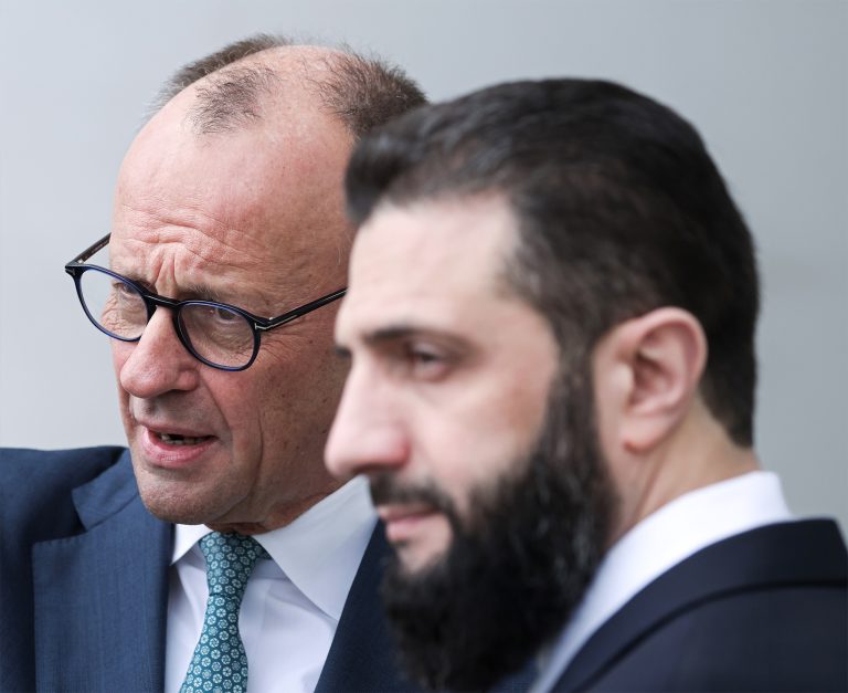 As the 80 per cent figure circulates, neither Friedrich Merz nor Ahmed al-Sharaa appears eager to claim it. Photo: Sean Gallup/Getty Images