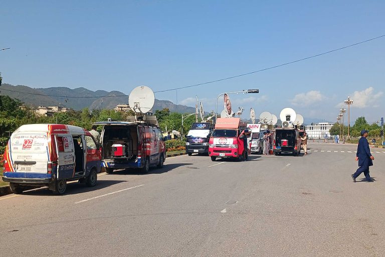 Iranian broadcast vans covering the war. Photo by Qamar Zaman/picture alliance via Getty Images
